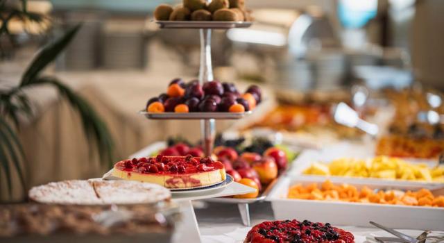 Colorful buffet with desserts and fresh fruit, an explosion of flavors and colors.